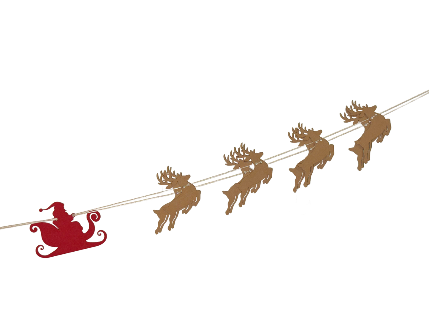 Decorative string with reindeer and Santa Claus sleigh on a white background