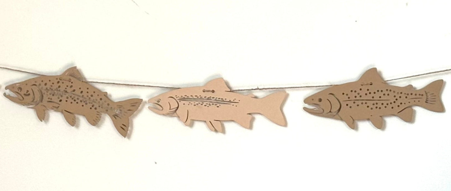 String of fish-shaped decorations on a white background